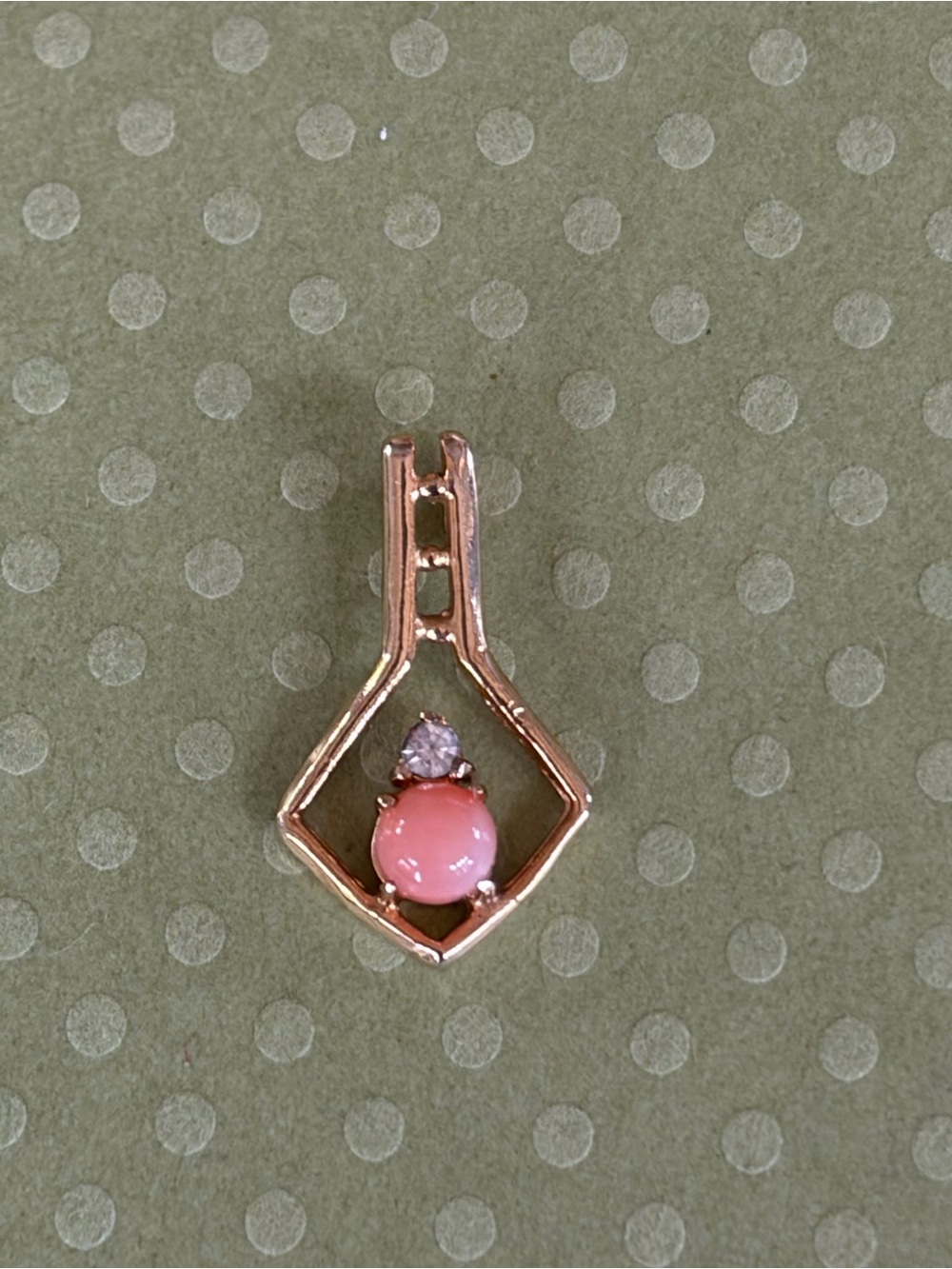 Vintage geometric gold coral and diamond pendant.
